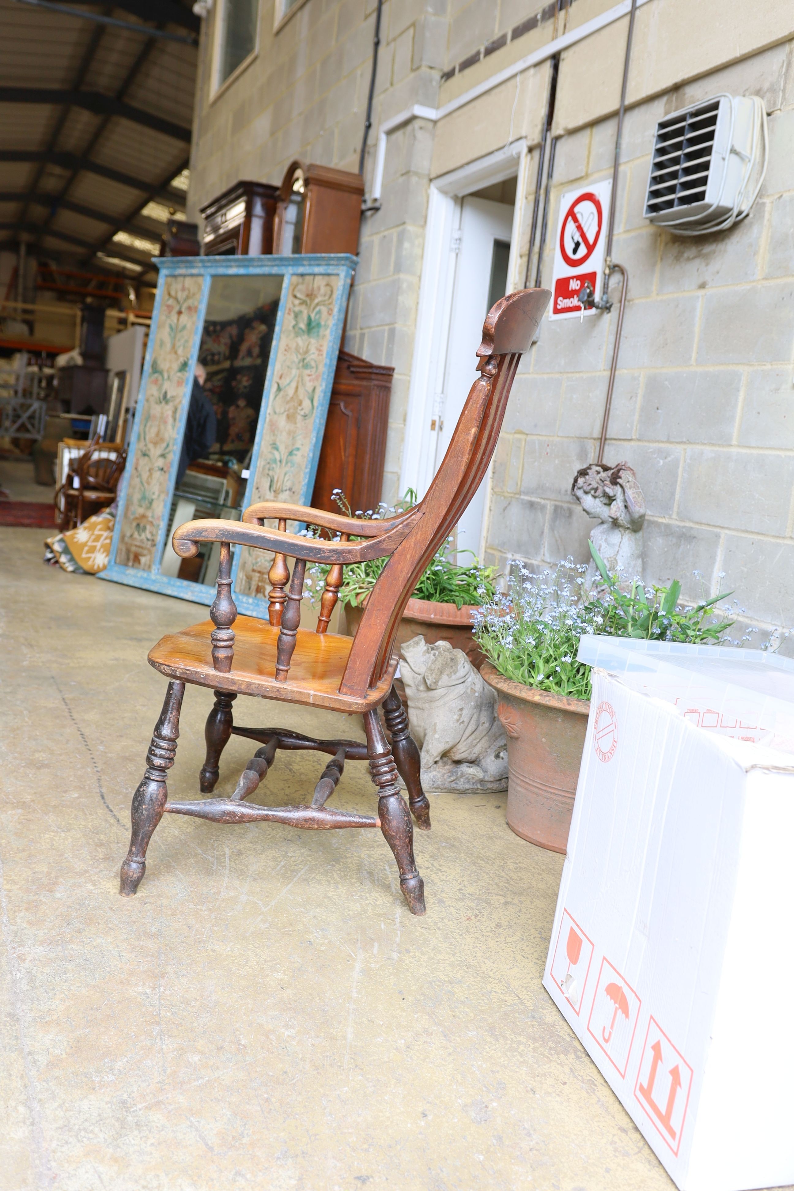 A Victorian elm and beech Windsor lathe back armchair.